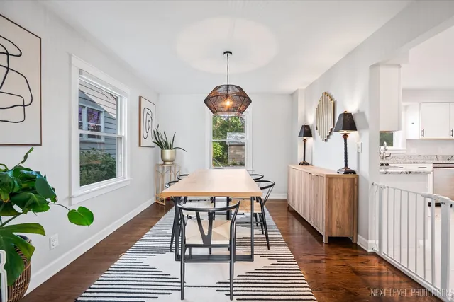 a dining room with furniture and a window