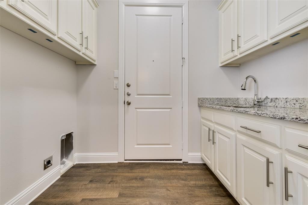 8841 Creek Run Road, Unit 403 Fort Worth, TX 76120 - Photo 23 of 26 a view of a kitchen with white cabinets