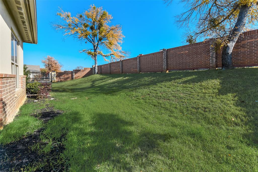 8841 Creek Run Road, Unit 403 Fort Worth, TX 76120 - Photo 24 of 26 a view of a backyard