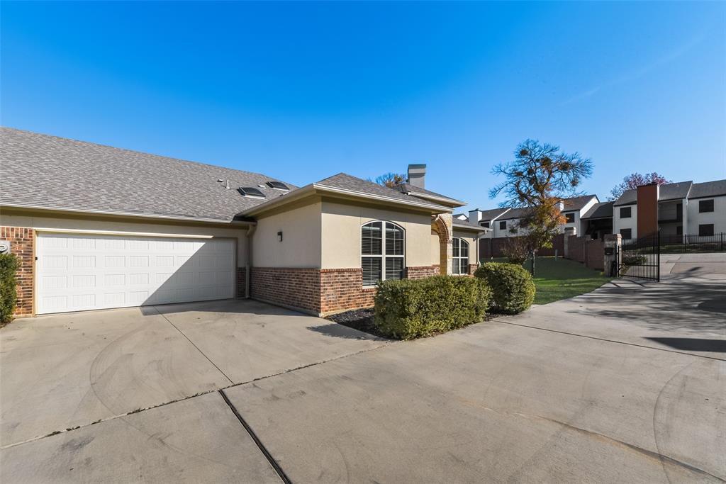 8841 Creek Run Road, Unit 403 Fort Worth, TX 76120 - Photo 25 of 26 a view of a house with a patio
