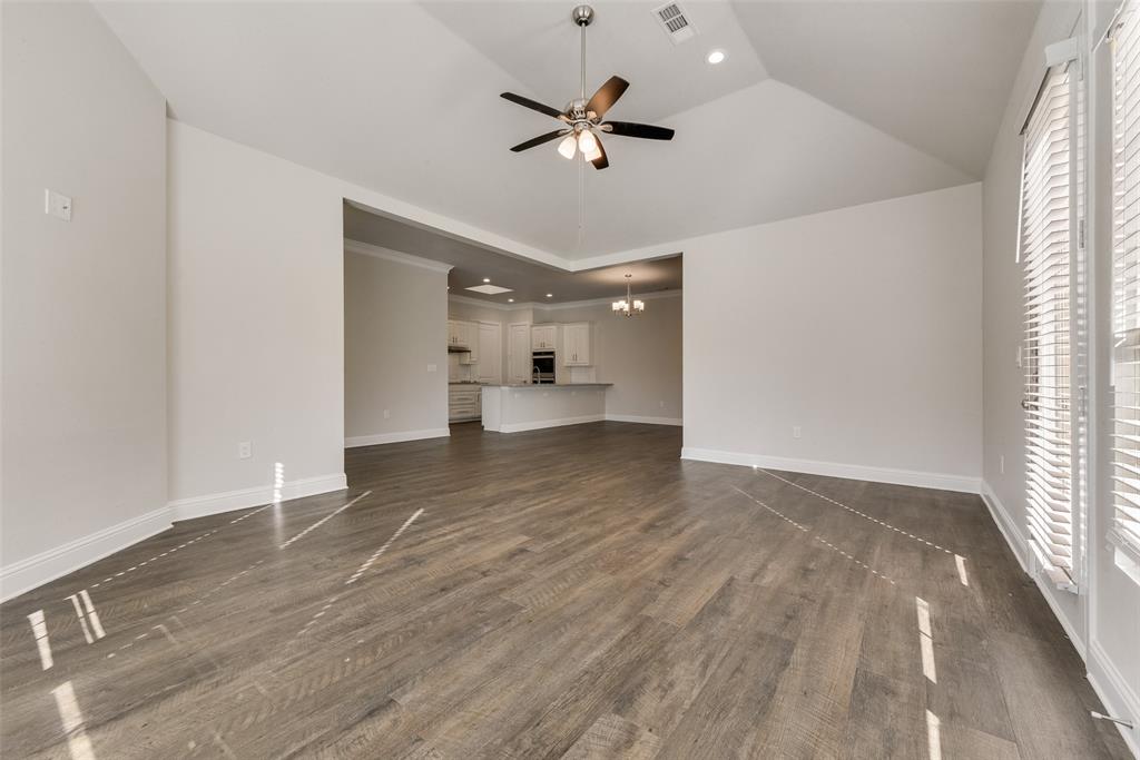 8841 Creek Run Road, Unit 403 Fort Worth, TX 76120 - Photo 7 of 26 wooden floor in an empty room with a window