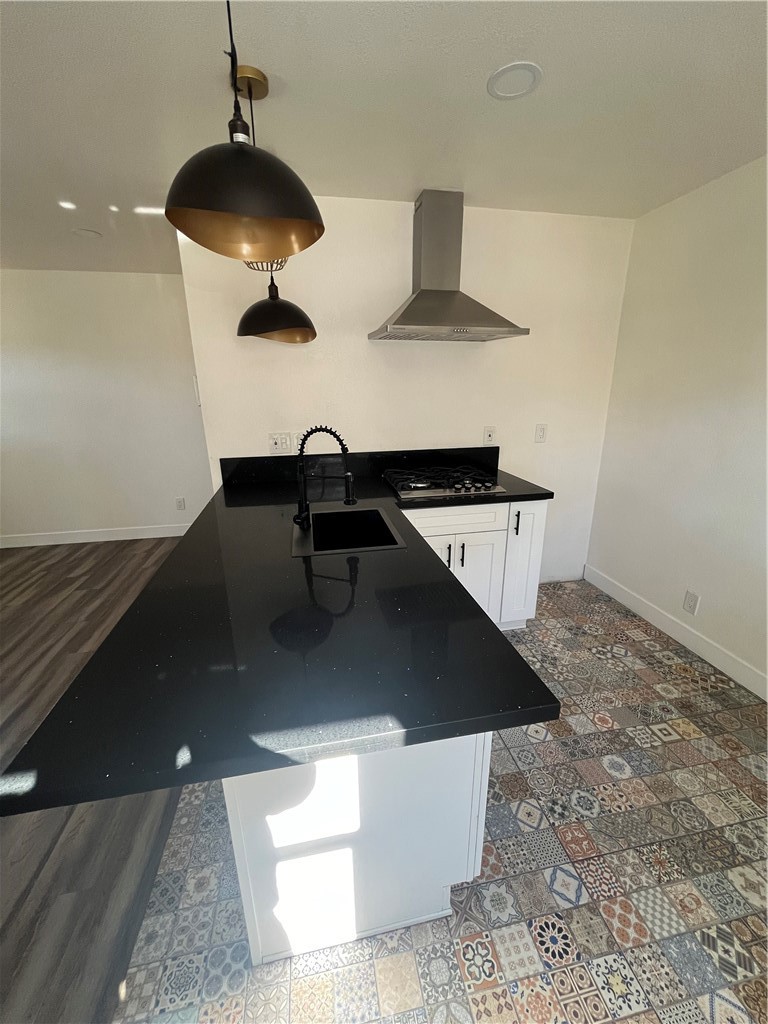 3438 Locust Street Riverside, CA 92501 - Photo 15 of 38 wooden floor in an empty room with a stove