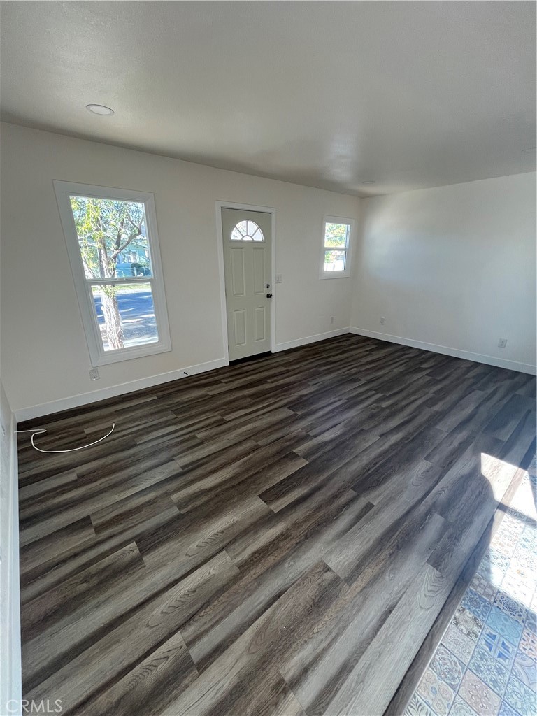 3438 Locust Street Riverside, CA 92501 - Photo 21 of 38 a view of empty room with window and wooden floor