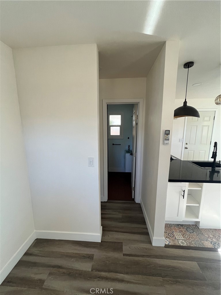 3438 Locust Street Riverside, CA 92501 - Photo 23 of 38 a view of a hallway with wooden floor and staircase