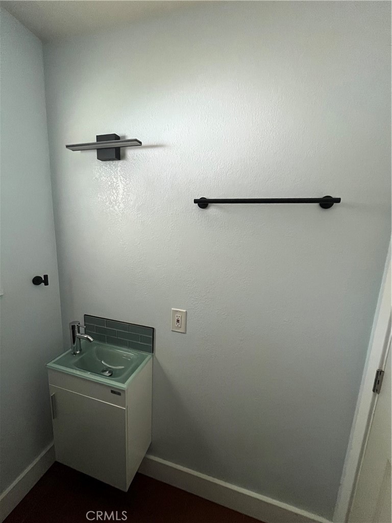 3438 Locust Street Riverside, CA 92501 - Photo 27 of 38 a bathroom with a sink and vanity