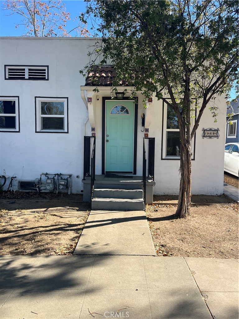 3438 Locust Street Riverside, CA 92501 - Photo 4 of 38 a view of a house with backyard and trees