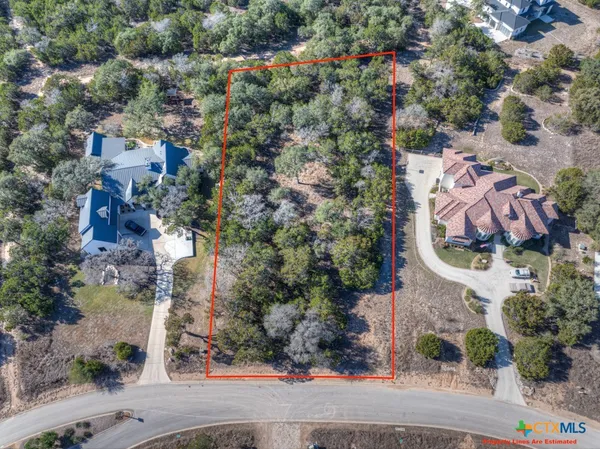 an aerial view of multiple house with yard