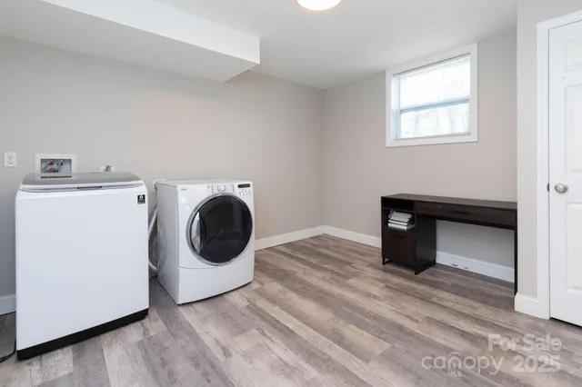 a view of a storage & utility room with washer and dryer