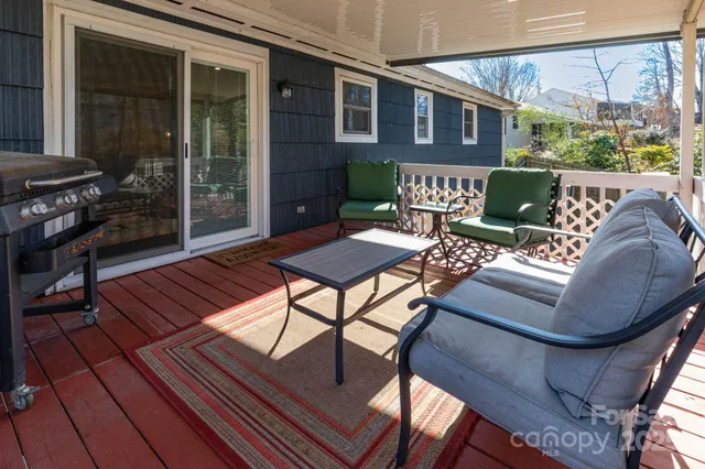 a view of a patio with couches table and chairs
