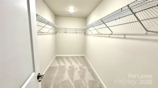 a view of a room with racks on the wall