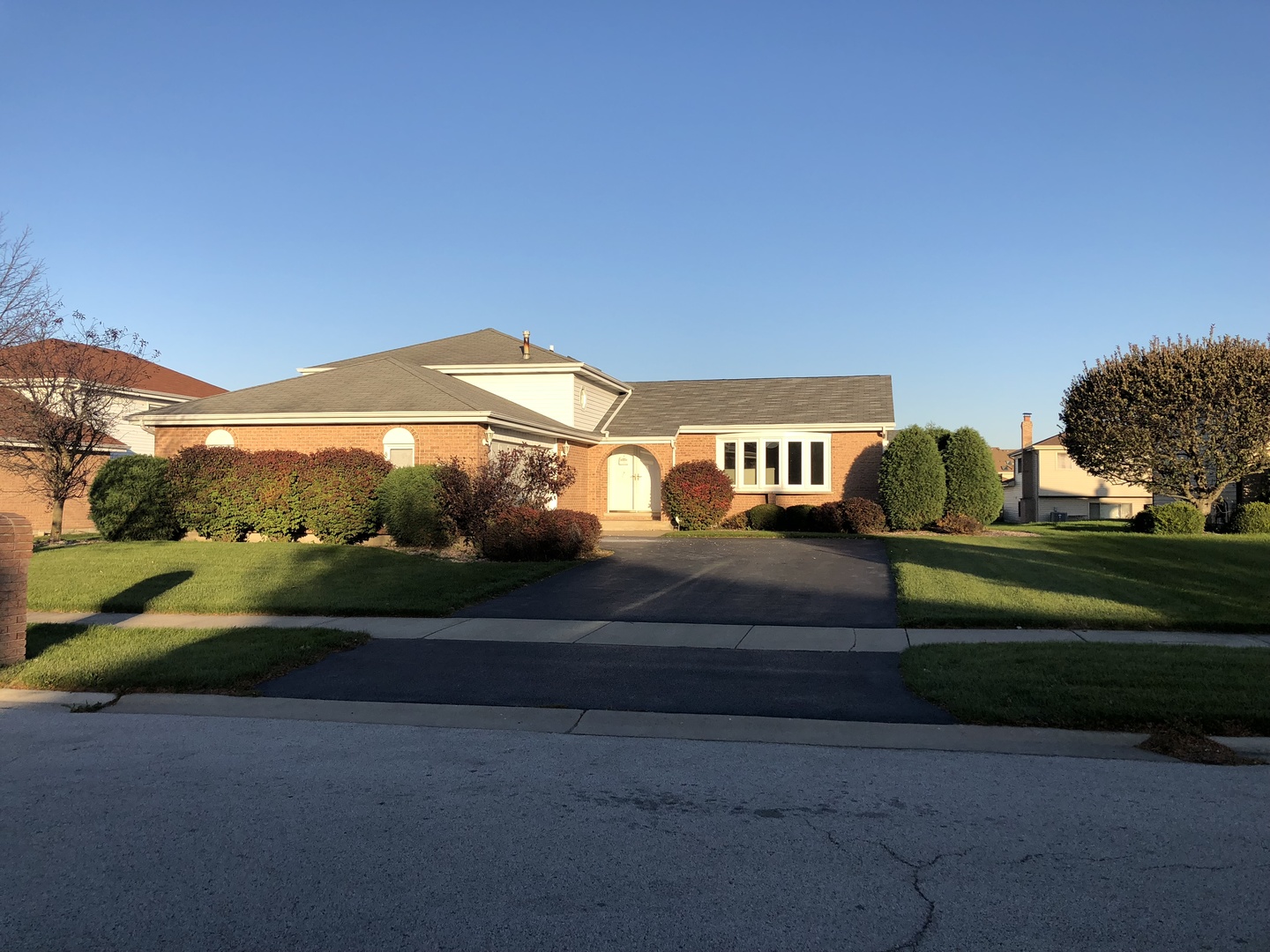 409 Highland Road Matteson, IL 60443 - Photo 1 of 21 a front view of a house with a yard