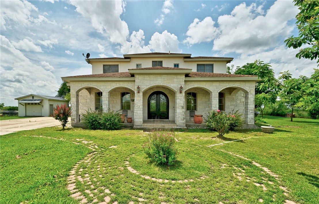 10508 Thaxton Road Austin, TX 78747 - Photo 1 of 1 a front view of a house with a garden