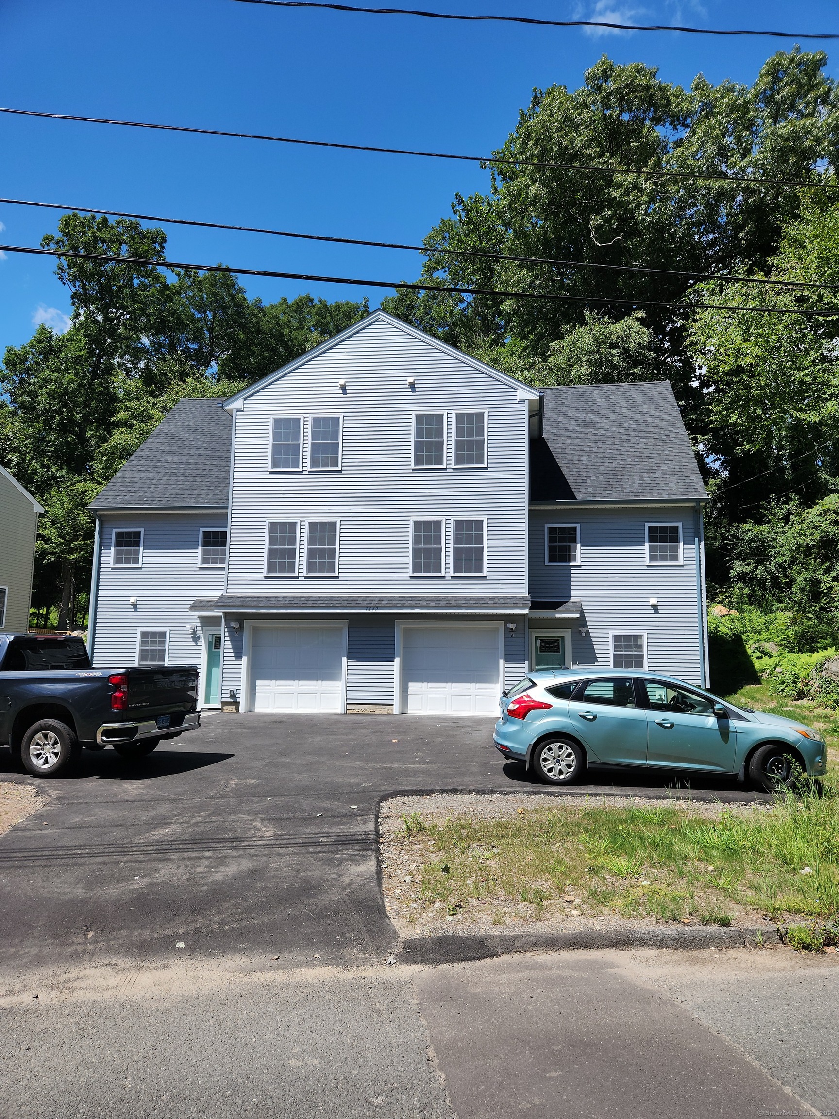 1642 Highland Avenue, Unit A Waterbury, CT 06708 - Photo 1 of 1 a front view of a house with a yard