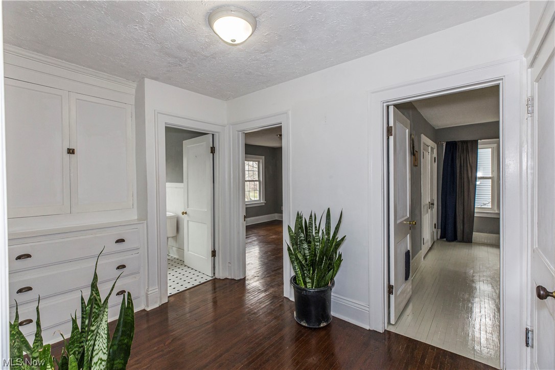 646 Copley Road Akron, OH 44320 - Photo 19 of 32 Corridor with dark tile floors and a textured ceiling