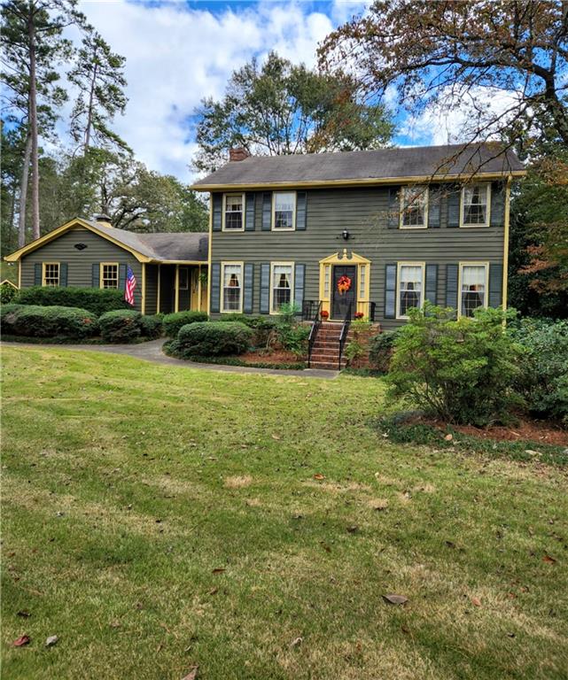 5170 Bailey Road Southwest Conyers, GA 30094 - Photo 1 of 1 a front view of a house with a yard