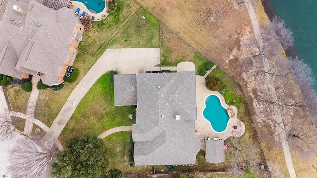 a aerial view of a house with a swimming pool