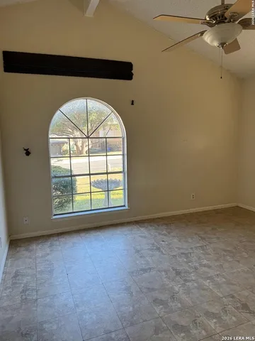 an empty room with a fireplace