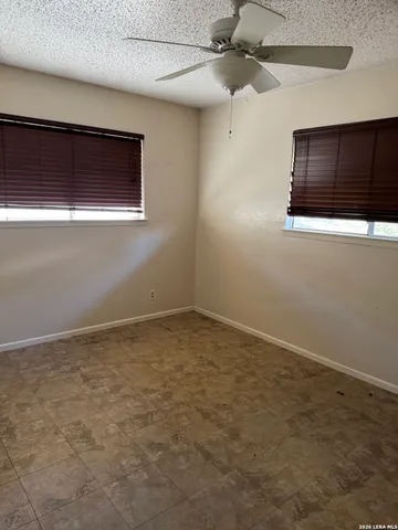 a view of empty room with fan