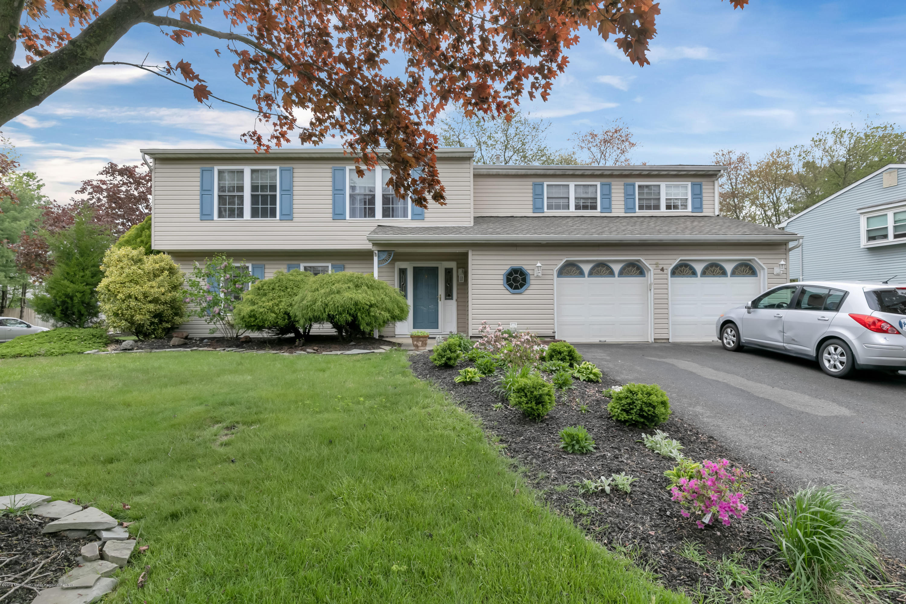 24 Starlight Road Howell, NJ 07731 - Photo 1 of 26 a house view with a garden space