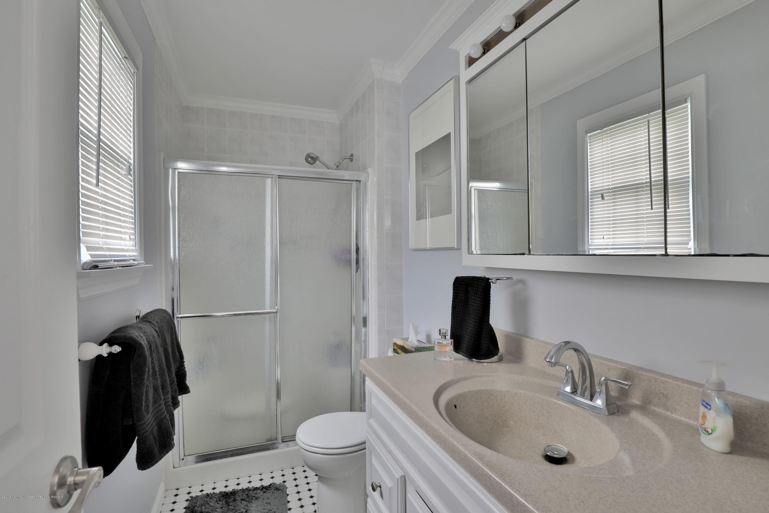 24 Starlight Road Howell, NJ 07731 - Photo 14 of 26 a bathroom with a sink toilet and shower