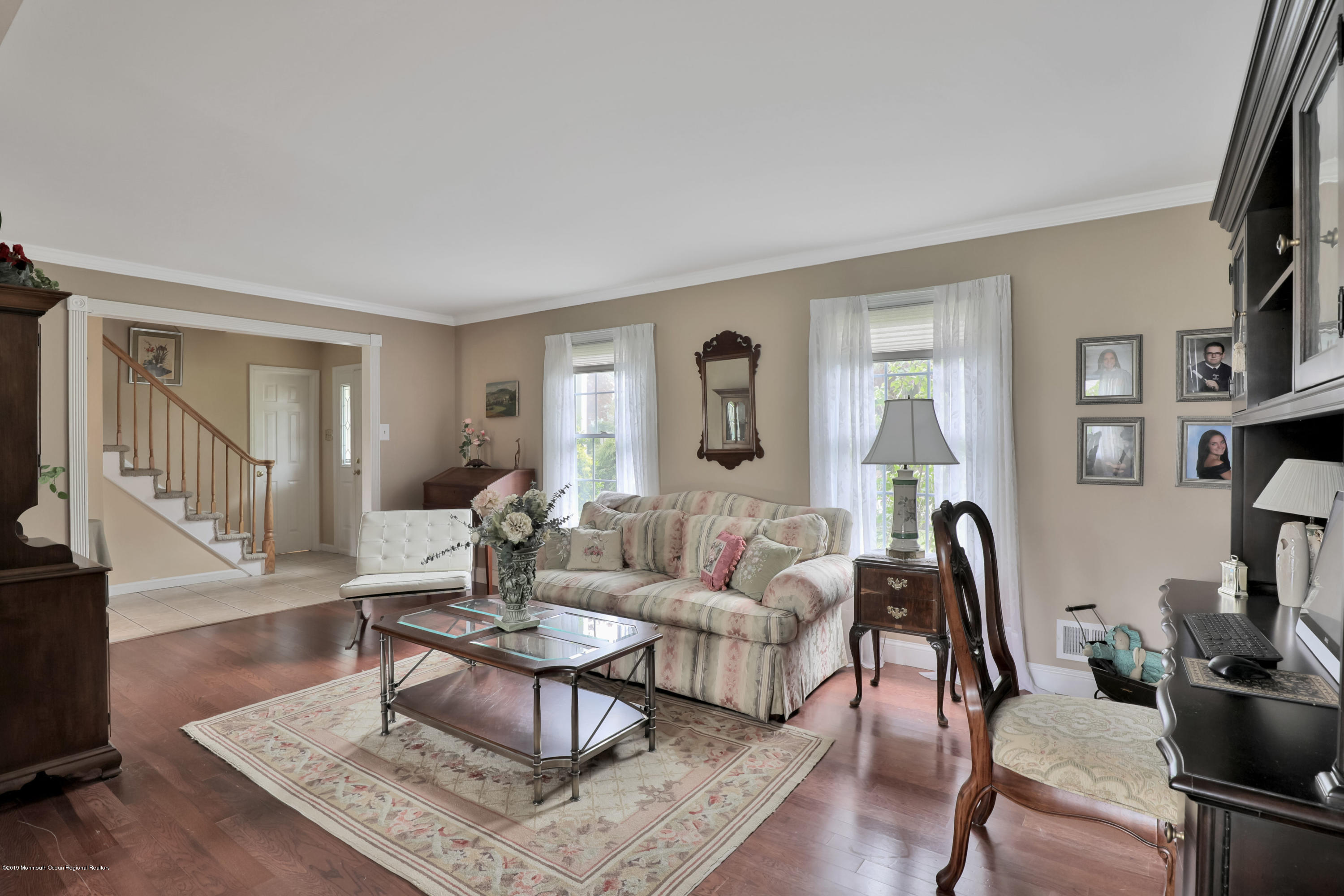 24 Starlight Road Howell, NJ 07731 - Photo 3 of 26 a living room with fireplace furniture and a window