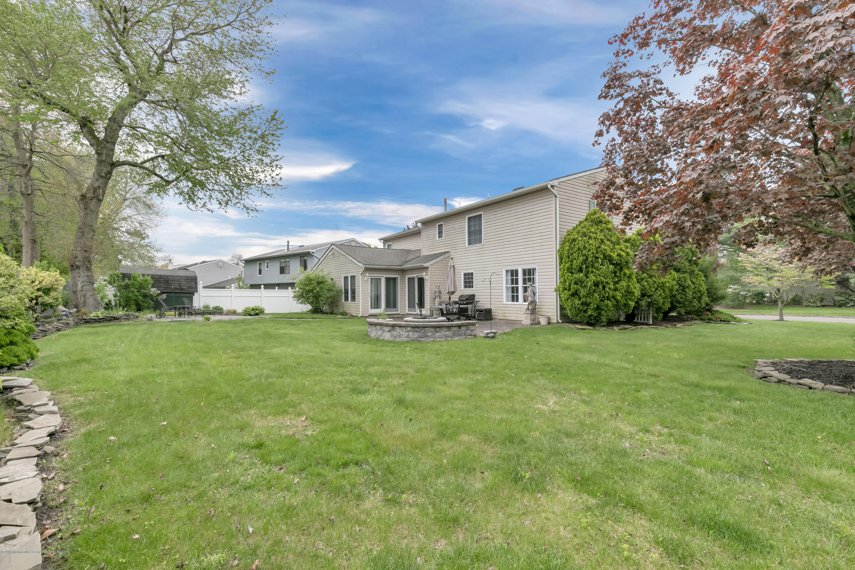 24 Starlight Road Howell, NJ 07731 - Photo 23 of 26 a view of a house with a big yard plants and large trees