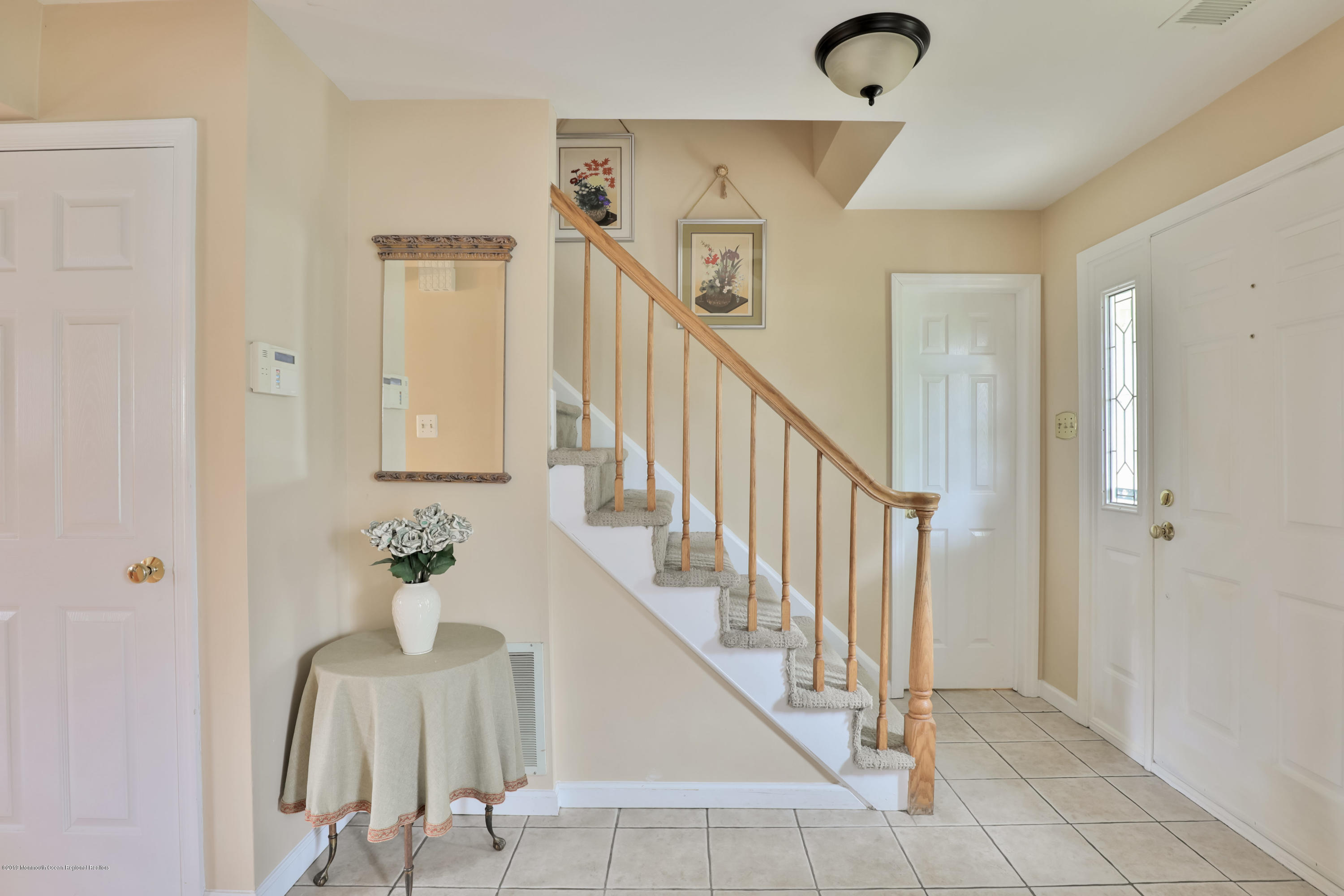 24 Starlight Road Howell, NJ 07731 - Photo 4 of 26 a view of entryway and hall with a mirror