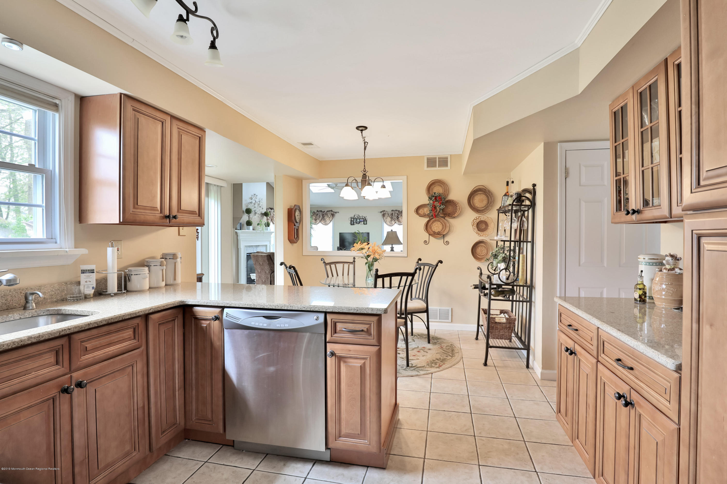 24 Starlight Road Howell, NJ 07731 - Photo 9 of 26 a kitchen with cabinets and chairs