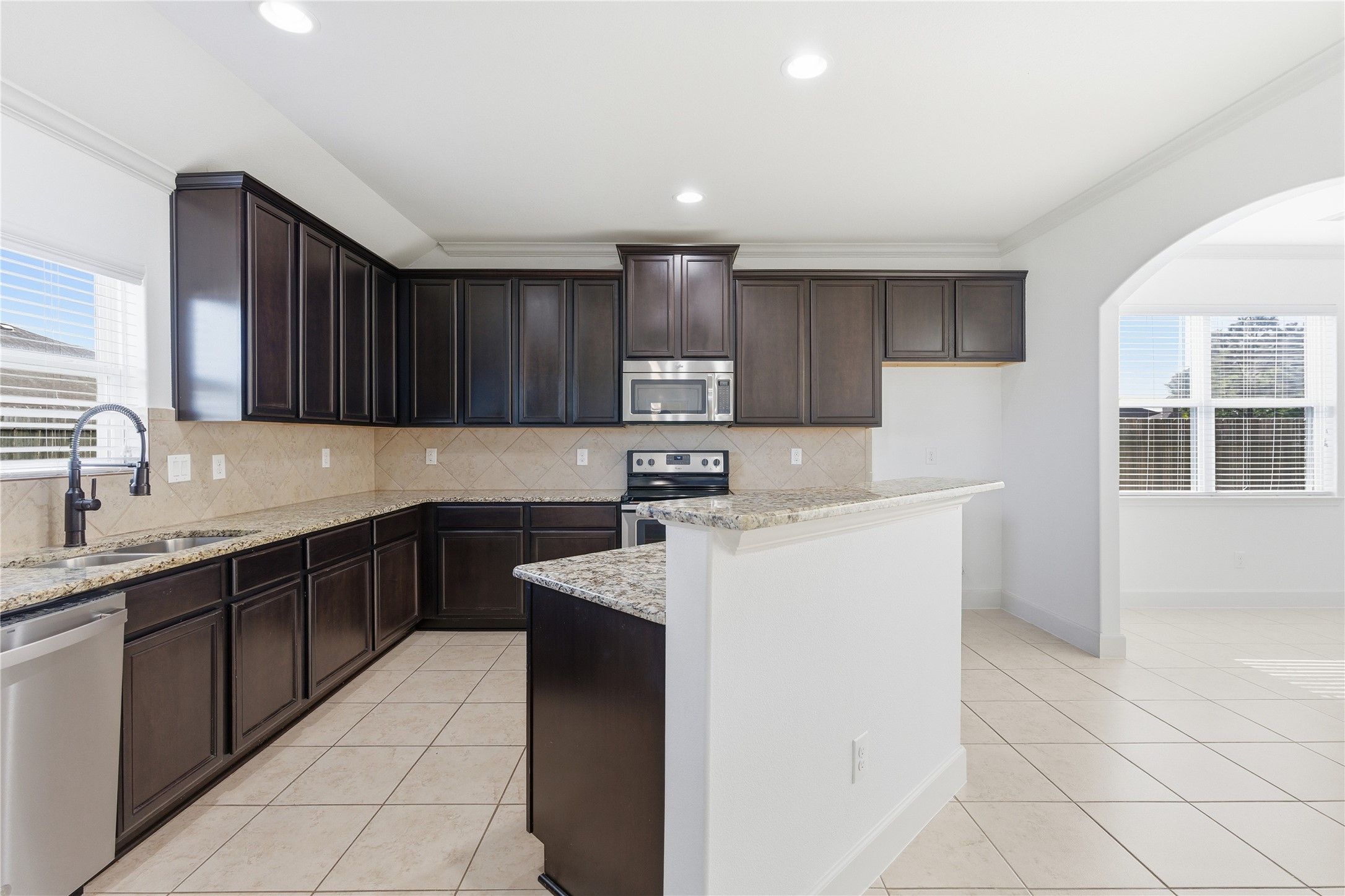 20614 Silver Tea Avenue Hockley, TX 77447 - Photo 12 of 27 a kitchen with a sink cabinets and window