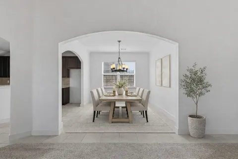 a view of a hallway with a chandelier