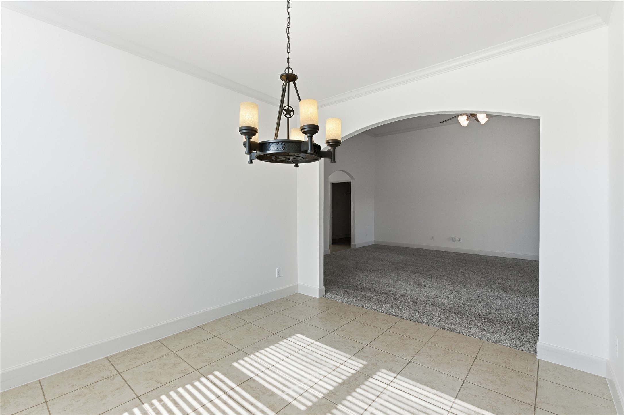 20614 Silver Tea Avenue Hockley, TX 77447 - Photo 14 of 27 a view of a hallway with a chandelier