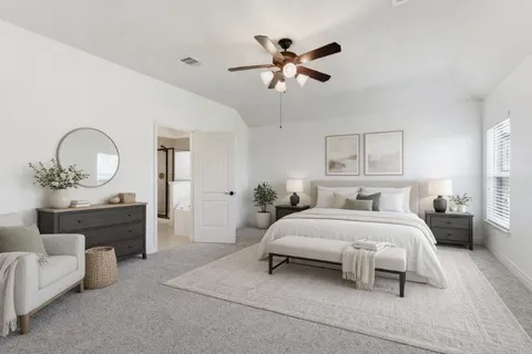 a view of an empty room and chandelier fan