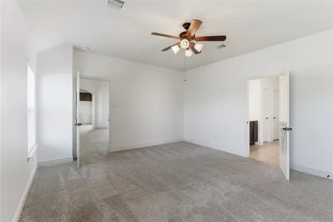 a view of a bathroom from the hallway