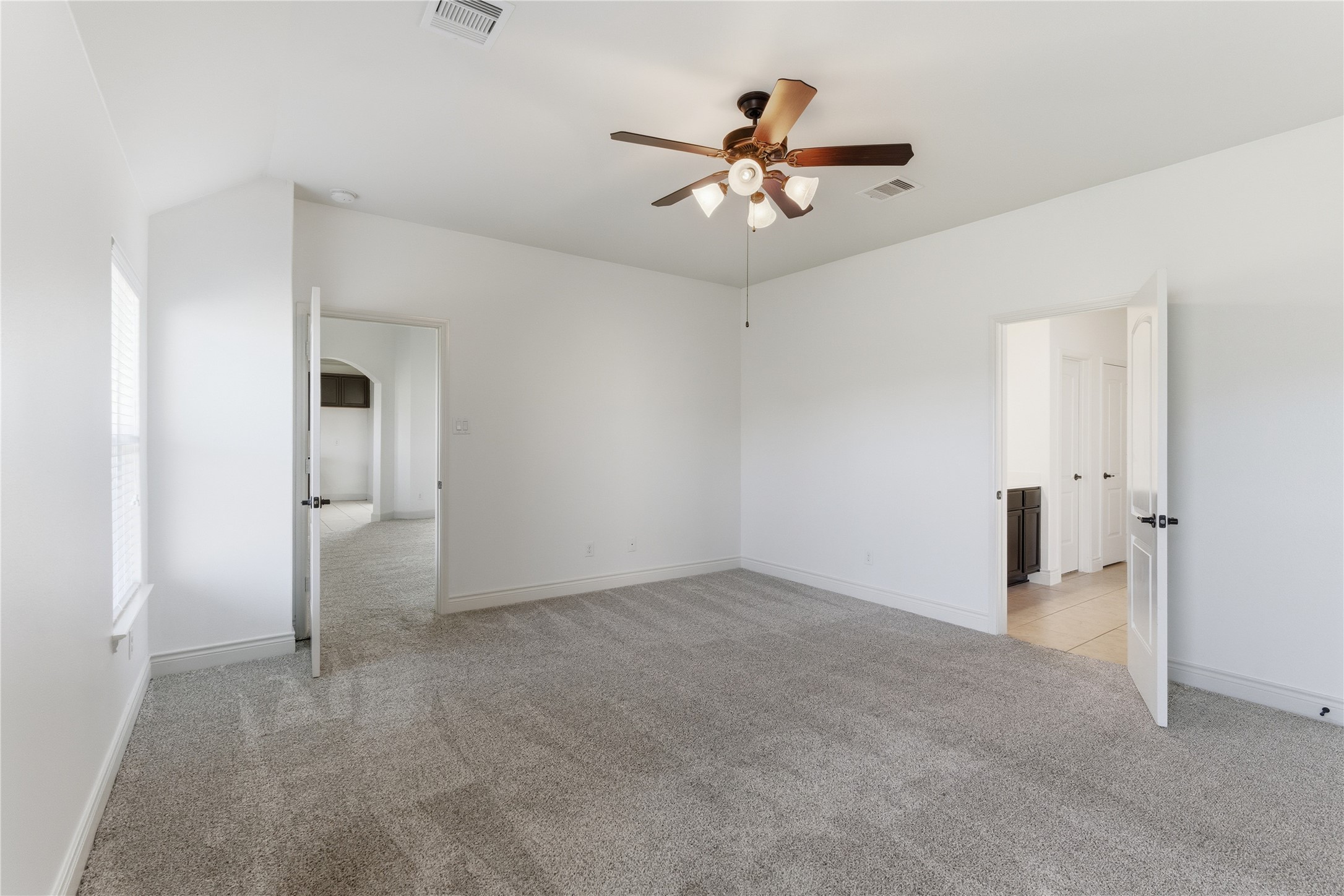 20614 Silver Tea Avenue Hockley, TX 77447 - Photo 16 of 27 a view of an empty room and chandelier fan