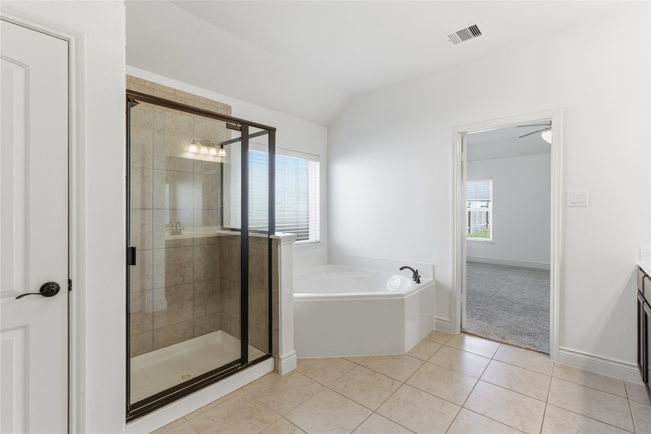 20614 Silver Tea Avenue Hockley, TX 77447 - Photo 19 of 27 a bathroom with a bathtub and shower
