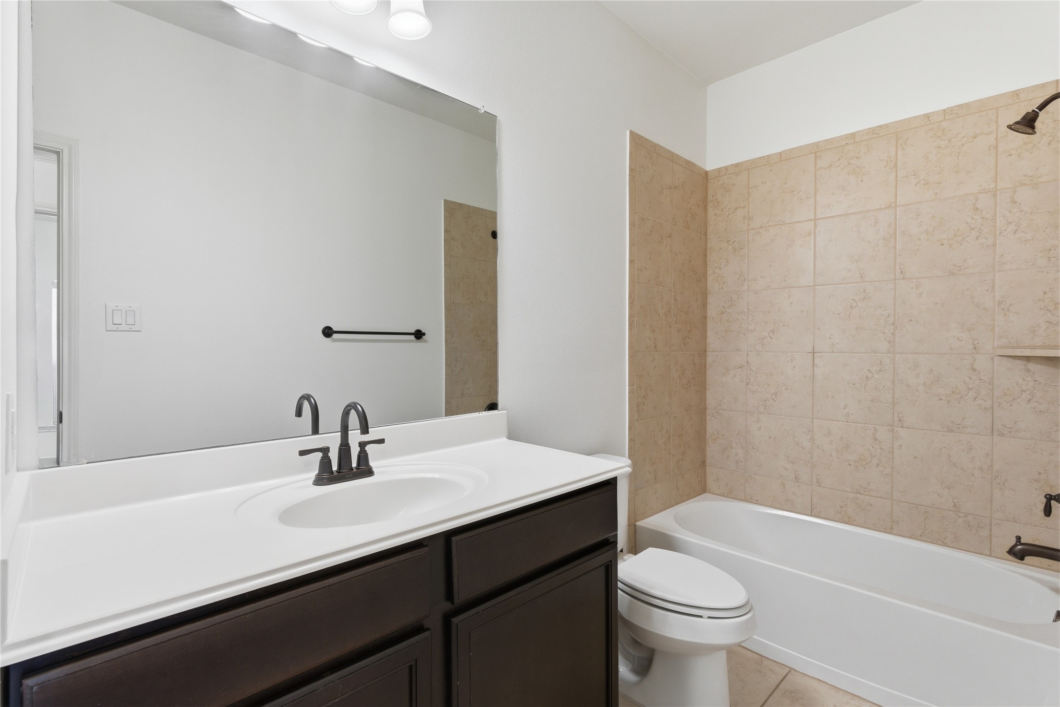 20614 Silver Tea Avenue Hockley, TX 77447 - Photo 24 of 27 a bathroom with a sink a toilet and a bathtub