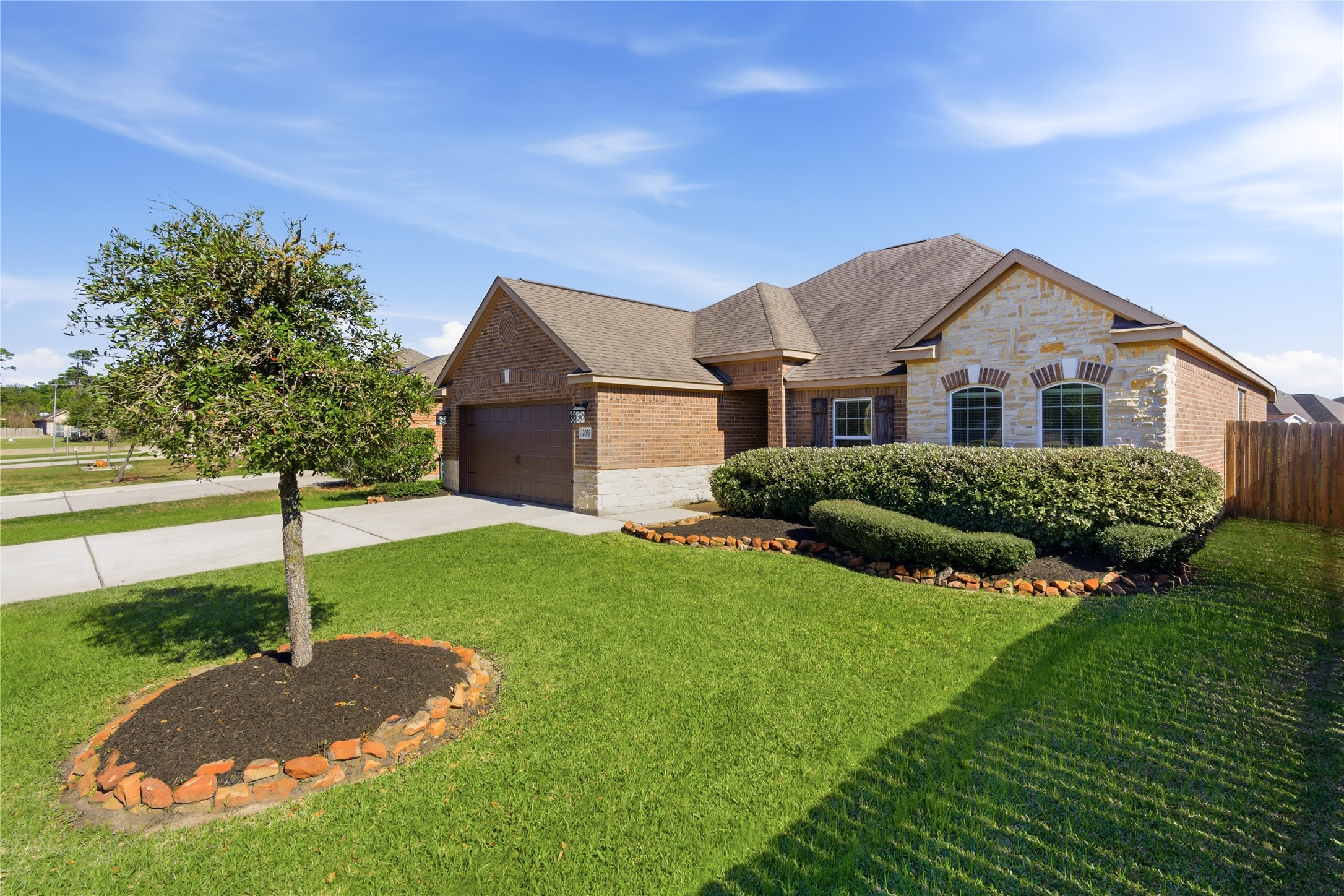 20614 Silver Tea Avenue Hockley, TX 77447 - Photo 27 of 27 a front view of a house with a yard and garage
