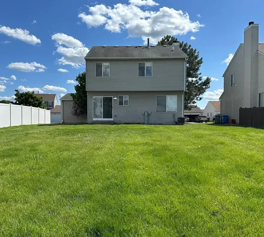 a view of a house with a yard