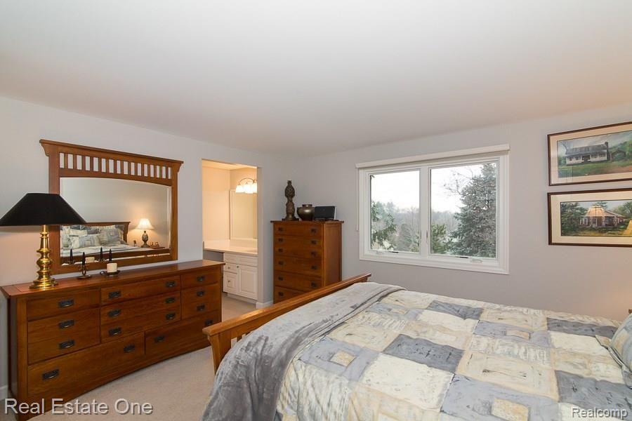 6376 Peach Tree Court Rochester, MI 48306 - Photo 22 of 27 Bedroom #4 with HUGE Walk-in Closet and its own Dressing Area with yup . . Another QUARTZ Counter