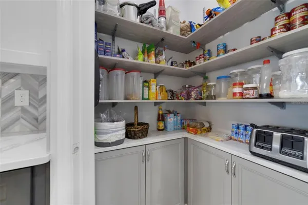 a kitchen with a fridge and cabinets