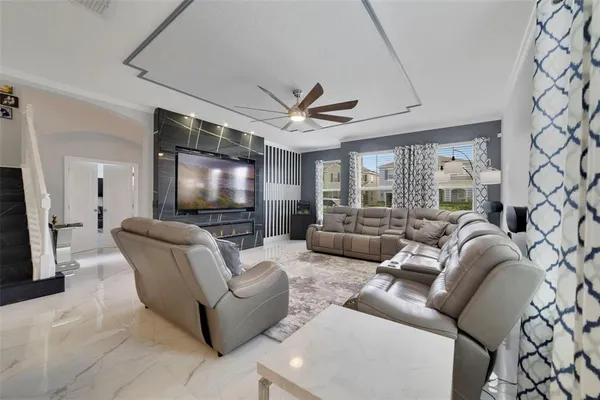 a living room with furniture and a flat screen tv