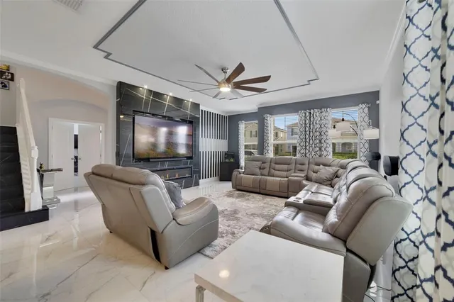 a living room with furniture and a flat screen tv
