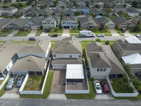 an aerial view of a house with a garden