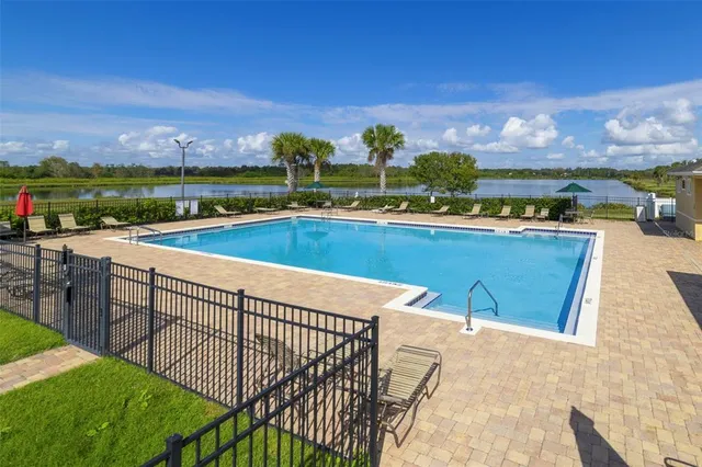 a view of a swimming pool with a terrace