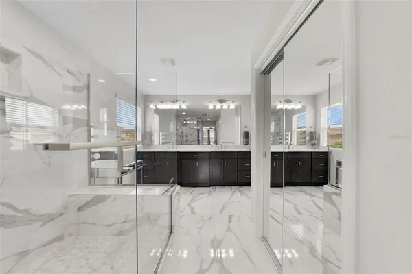 a large bathroom with a large tub and shower