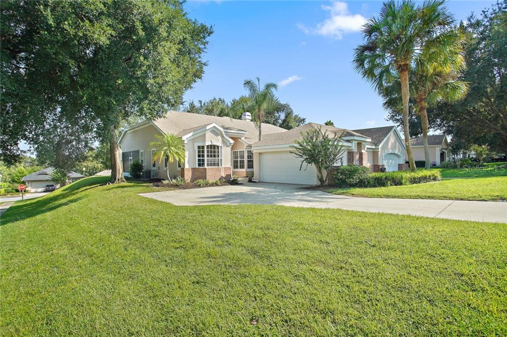 6236 Topsail Road Lady Lake, FL 32159 - Photo 1 of 1 Front Exterior with Mature Landscaping
