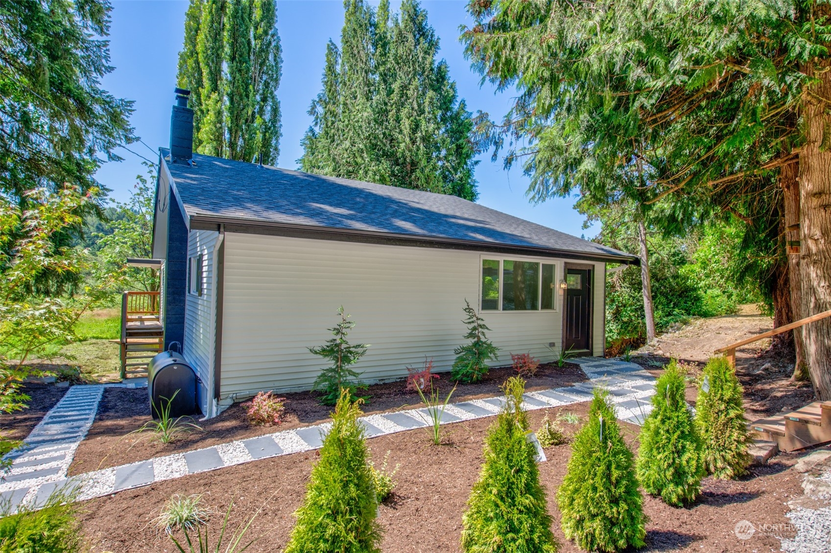 17315 Southeast May Valley Road Renton, WA 98059 - Photo 1 of 25 a front view of a house with garden