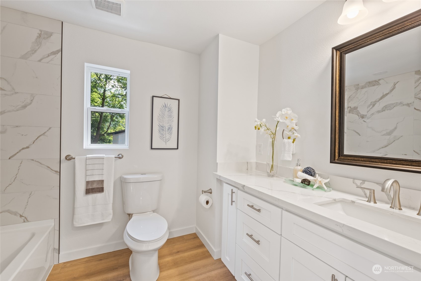 17315 Southeast May Valley Road Renton, WA 98059 - Photo 11 of 25 a bathroom with a granite countertop toilet sink and a mirror