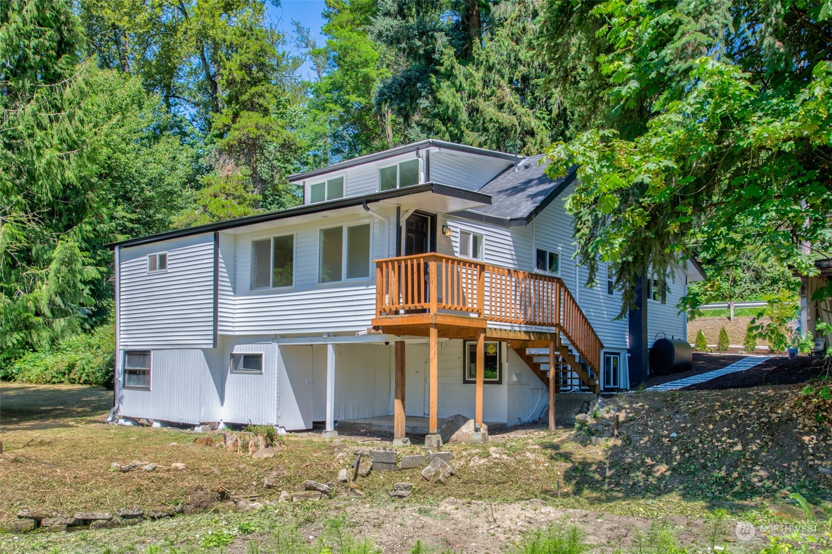 17315 Southeast May Valley Road Renton, WA 98059 - Photo 2 of 25 a front view of a house with a yard