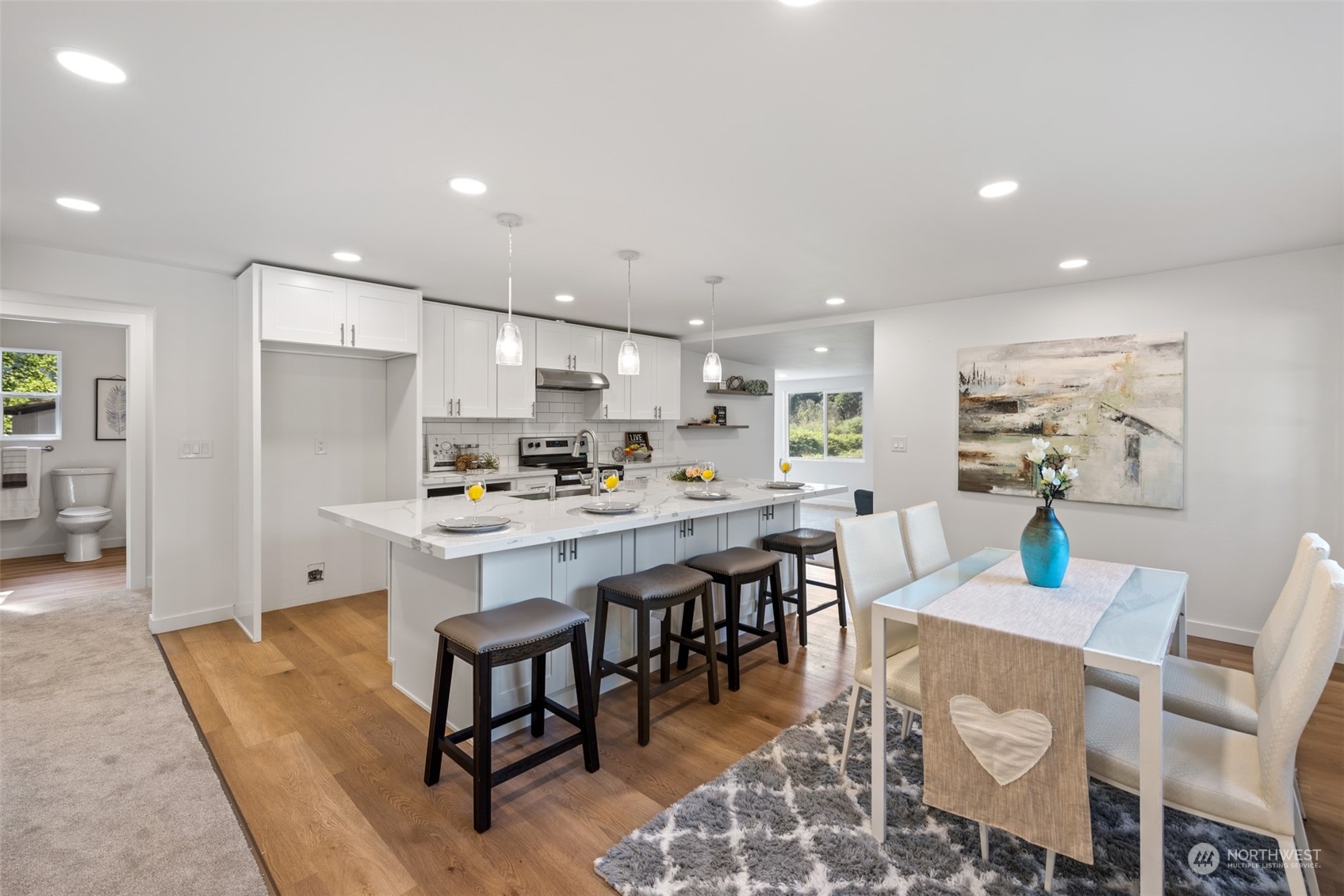17315 Southeast May Valley Road Renton, WA 98059 - Photo 6 of 25 a large kitchen with a table and chairs
